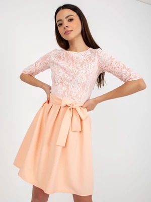 Peach cocktail dress with lace and tie