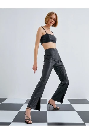 Koton Leather Look Trousers with Slit Detail.