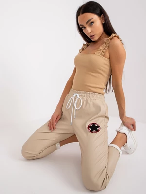 Beige trousers made of eco-leather with pockets of Lana