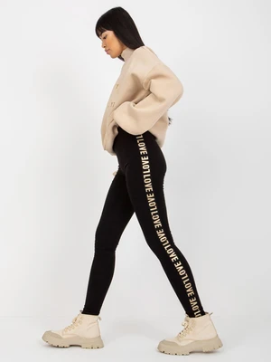 Black casual leggings with lettering on the sides