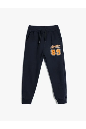 Koton Jogger Sweatpants with Tied Waist and Sports Print Detail