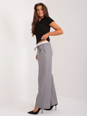 Grey fabric trousers with pockets