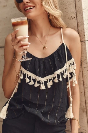 Black boho blouse with tassels on hangers