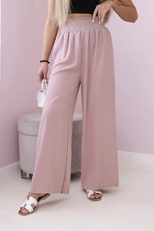 Trousers with a wide elastic waistband in dark pink colour