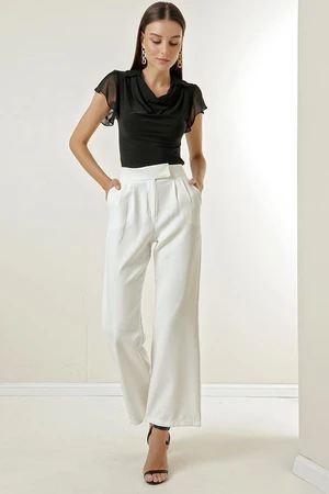 By Saygı A snap fastener at the waist, Pockets and Wide Leg Trousers.