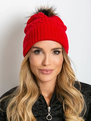 Red hat with fur pompom