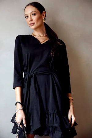 Simple black dress with ruffles and belt