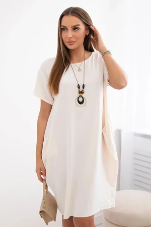 Dress with pockets and pendant light beige