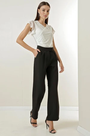 By Saygı A snap fastener at the waist, Pockets and Wide Leg Trousers.