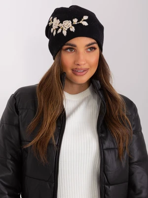 Black and beige knitted beanie with appliqué and rhinestones