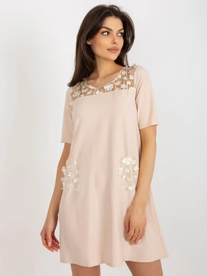 Beige cocktail dress with floral application