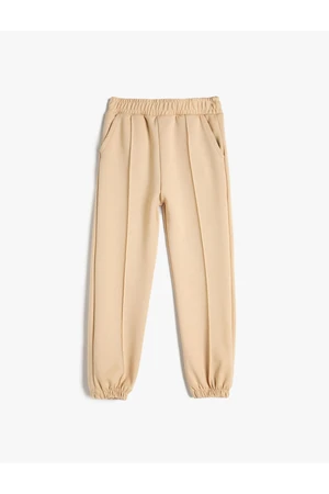 Koton Basic Jogger Trousers with ribs at the waist, elasticated waist and pockets.