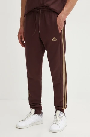 Bavlněné tepláky adidas Essentials hnědá barva, s aplikací, IW7681