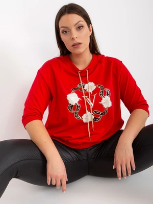 Red oversized blouse with rhinestone appliqué