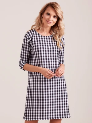 Lady's black plaid dress