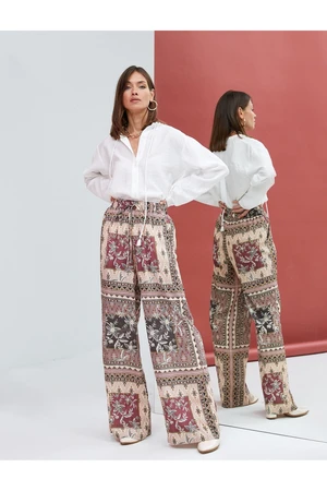 Koton The Wide Leg Trousers have a lace-up waist, pocket detail, relaxed fit.