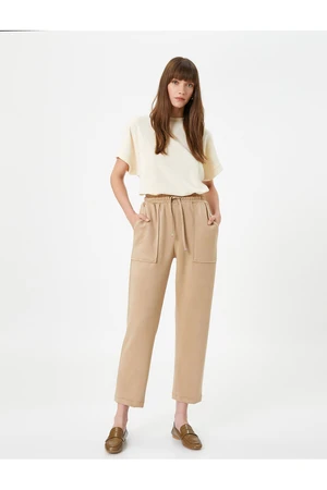 Koton Tie Waist Trousers with Suede Textured Pockets and Tapered Legs.