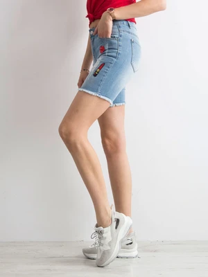 Blue denim shorts with patches