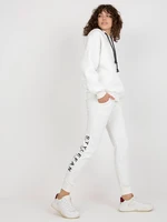 Ecru women's tracksuit with inscriptions and zippers