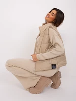 Beige women's vest with stitching