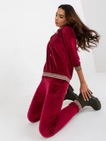 Burgundy two-piece velour set with trousers