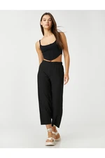 Koton The relaxed fit trousers have an elasticated waist and cropped legs.