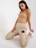 Beige trousers made of eco-leather with pockets of Lana