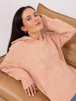 Peach sweater with cables and collar