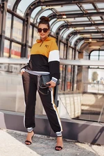 Women's sports set with a mustard hood