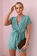 Short jumpsuit with a dark mint waist tie