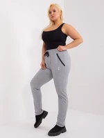 Grey melange trousers in a larger size with patch