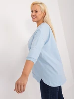 A light blue plus-size blouse with slits