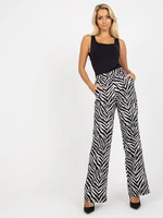 Black and white wide trousers made of animal print fabric