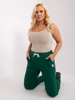 Tmavě zelené tepláky plus size velikosti