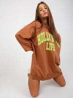 Light brown and green long sweatshirt with slogan