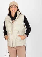 Light beige down vest made of artificial leather without hood