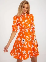 Orange zippered dress with print and belt