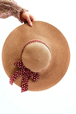 Fashionable hat with bow beige