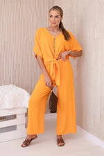 Set of bright orange blouse and trousers