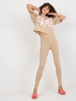 Beige sports set with inscriptions and leggings