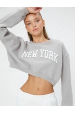 Koton The Slogan Printed Crop Sweatshirt is a relaxed fit with Long Sleeves.