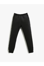 Koton Basic Jogger Sweatpants with Stripe Detail around the Sides.