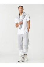 Koton Basic Jogger Sweatpants with Lace-Up Waist and Floral Print.