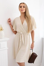 Women's dress with a plunging neckline - beige