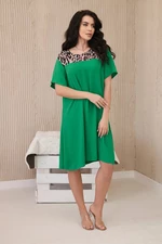Dress with an animal motif in bright green color