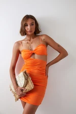 Sensual mini dress with a neon orange cutout