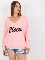 Light pink and black sweatshirt with printed design and V-neck