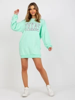 Light green oversized sweatshirt with print