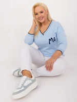 A light blue blouse in a larger size with cuffs