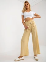 Dark yellow fabric trousers with elastic waistband